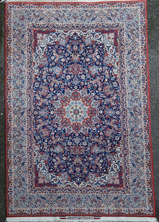 A fine Tabriz blue ground rug, 7ft 10in by 4ft 10in.